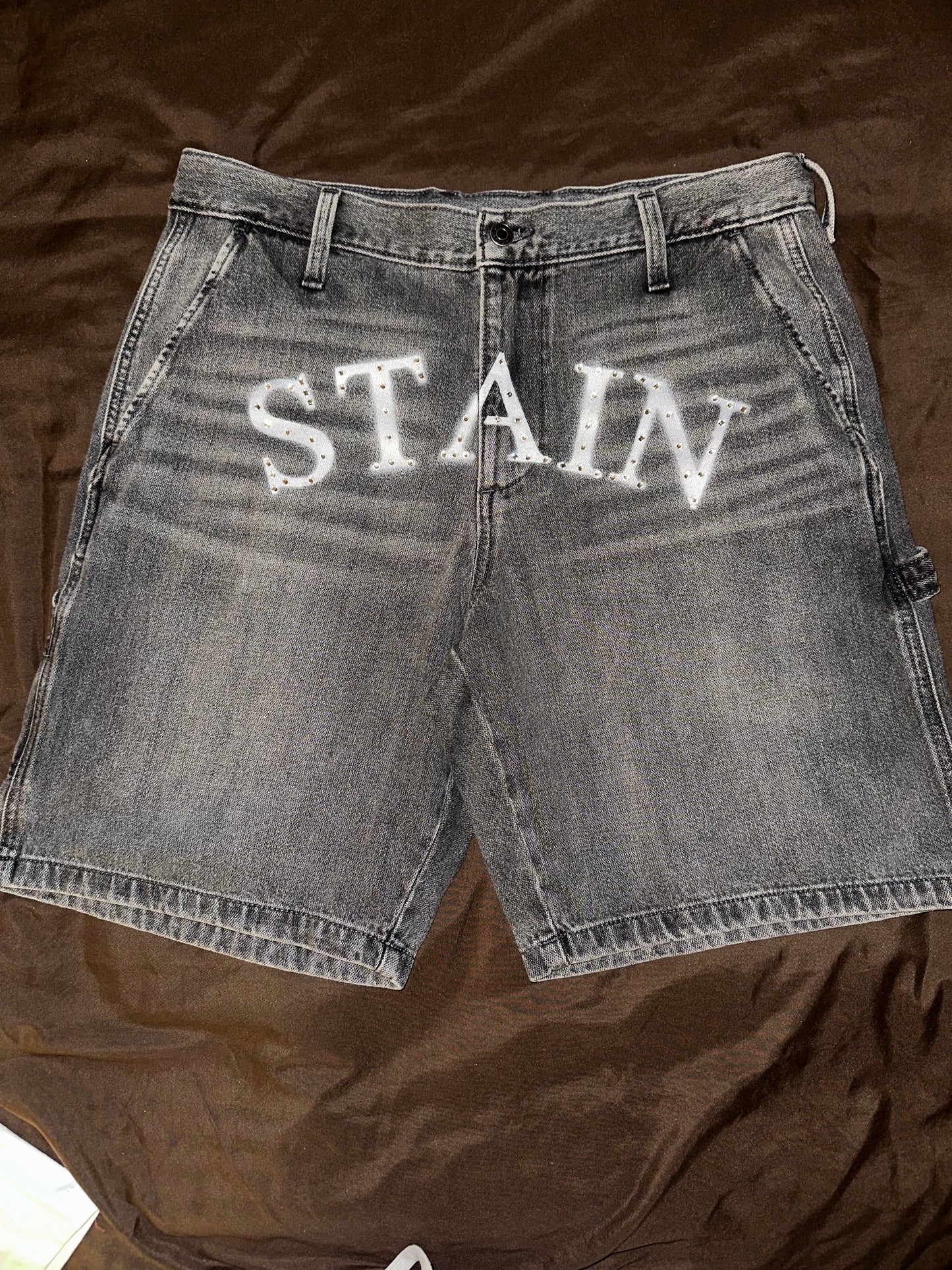Stain “Bustdown” denim shorts