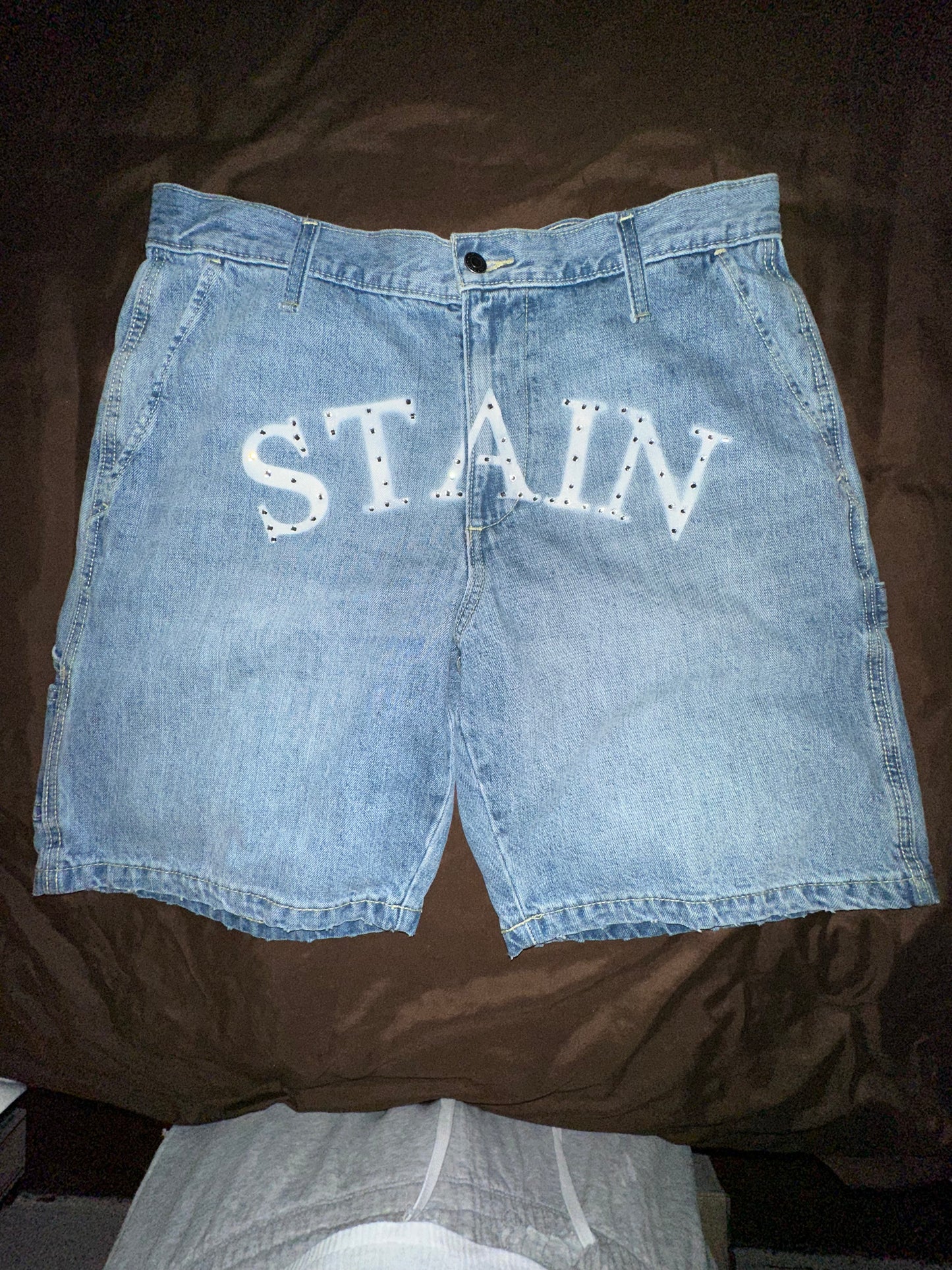 Stain “Bustdown” denim shorts